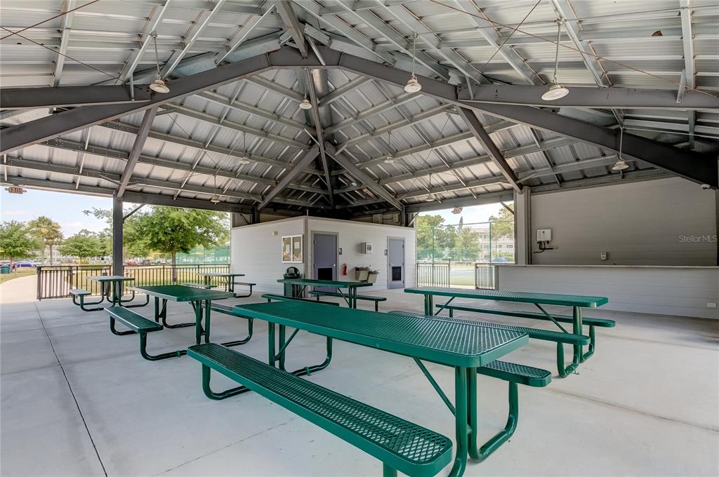 2170 Americus Boulevard North, Unit 64 Clearwater, FL 33763 - Photo 52 of 66 a view of a chairs and table in a patio
