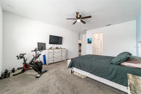a bedroom with furniture and a window