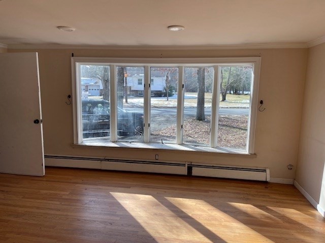 191 Lancaster Road Berlin, MA 01503 - Photo 11 of 22 a view of an empty room with wooden floor and a window