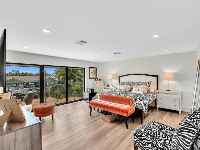 a view of a house with swimming pool and sitting area