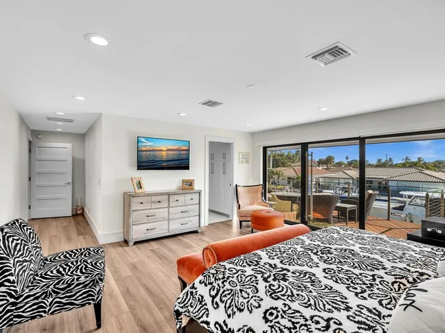 a view of a swimming pool with sitting area