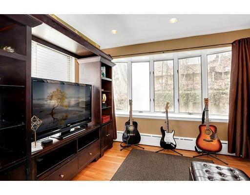 95 Welland Road Brookline, MA 02445 - Photo 14 of 28 a living room with furniture and a flat screen tv