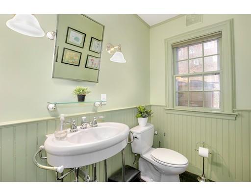 95 Welland Road Brookline, MA 02445 - Photo 15 of 28 a bathroom with a toilet sink and mirror