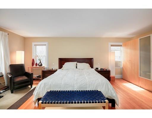 95 Welland Road Brookline, MA 02445 - Photo 17 of 28 a bedroom with a bed and wooden floor