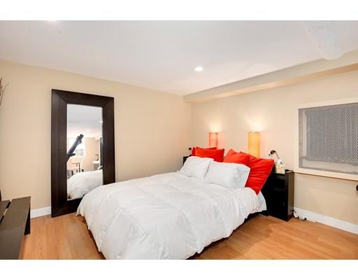 95 Welland Road Brookline, MA 02445 - Photo 20 of 28 a bedroom with a bed and a painting on the wall