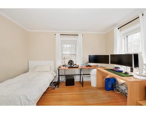 95 Welland Road Brookline, MA 02445 - Photo 24 of 28 a living room with furniture and a flat screen tv
