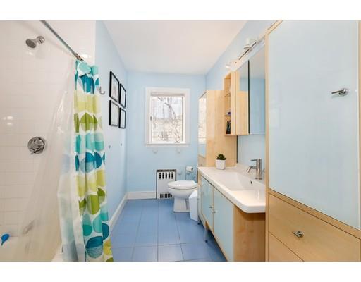 95 Welland Road Brookline, MA 02445 - Photo 25 of 28 a bathroom with a sink a toilet and a mirror