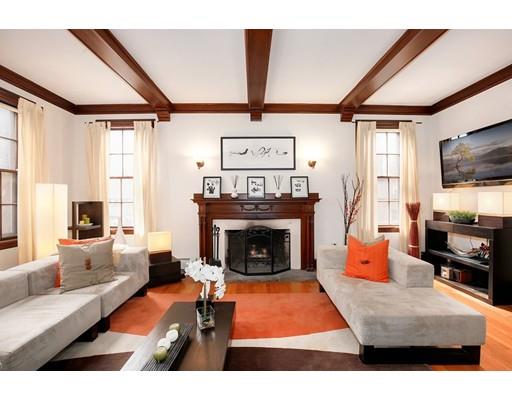 95 Welland Road Brookline, MA 02445 - Photo 4 of 28 a living room with furniture a flat screen tv and a fireplace