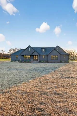 a view of a house next to a yard