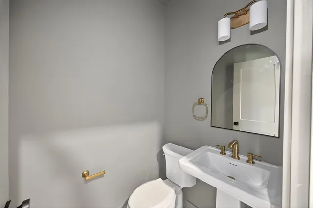 a view of a house with a yard and lake view