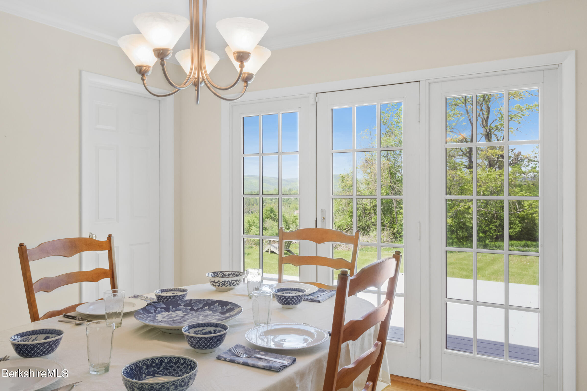 79 View Drive Richmond, MA 01201 - Photo 15 of 34 a dining room with furniture a large window and wooden floor