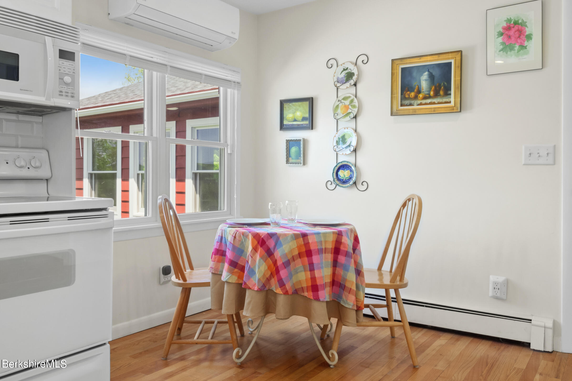 79 View Drive Richmond, MA 01201 - Photo 18 of 34 a view of a dining room with furniture and wooden floor