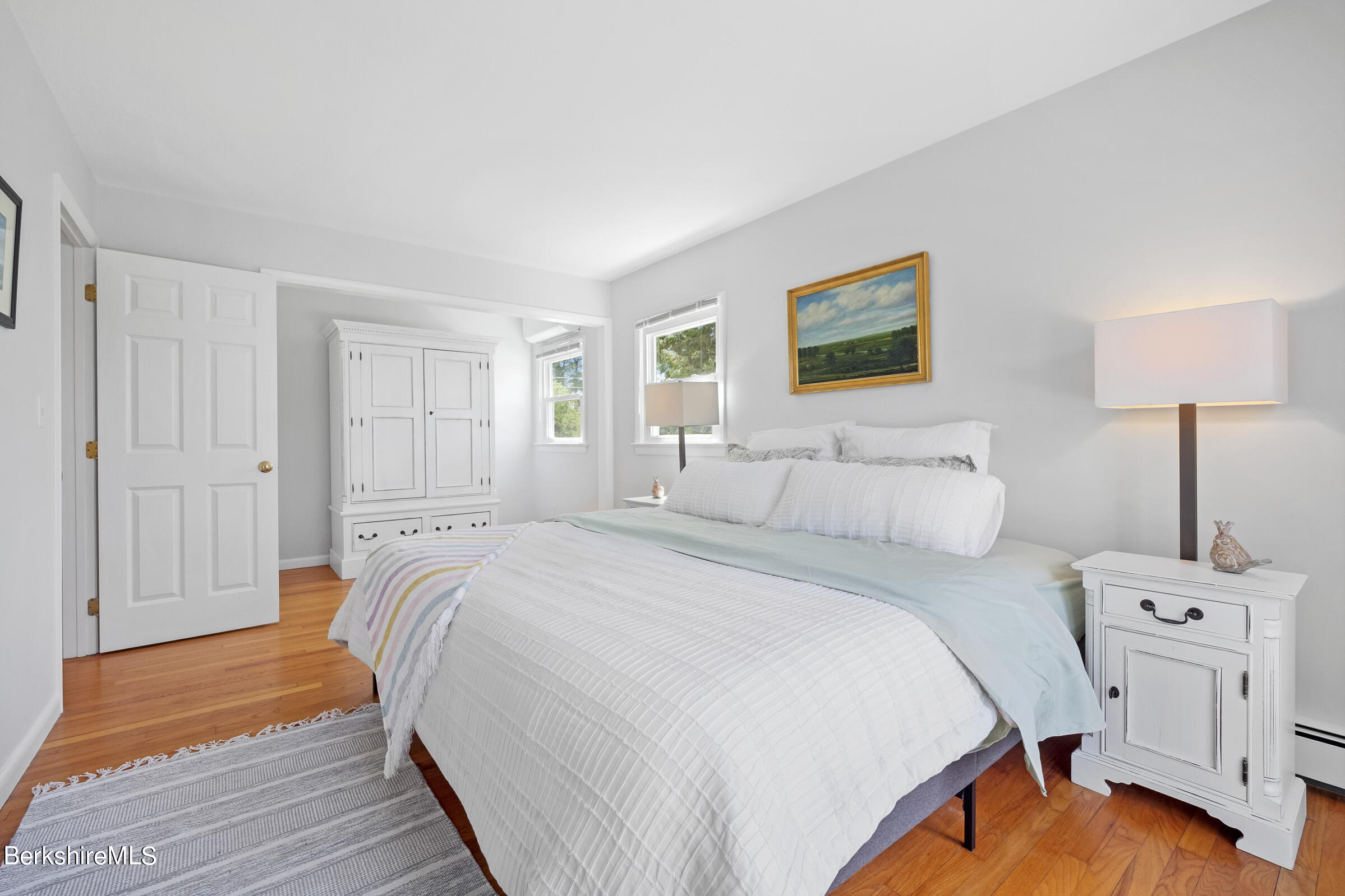 79 View Drive Richmond, MA 01201 - Photo 23 of 34 a bedroom with a bed and a lamp