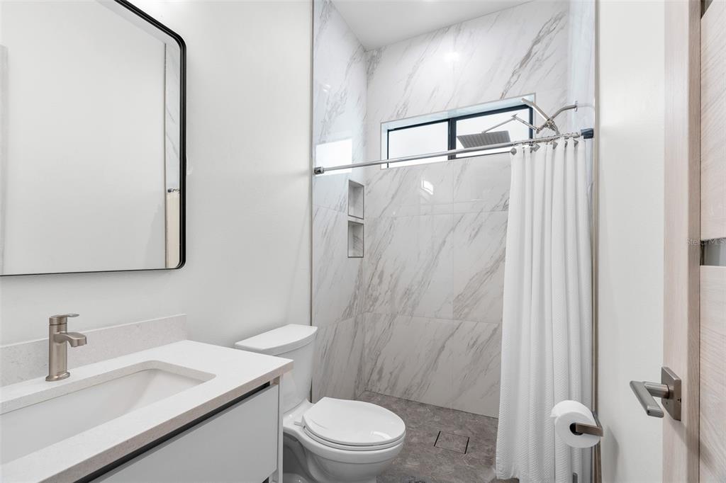 380 Cowry Road Venice, FL 34293 - Photo 28 of 44 a bathroom with a sink a toilet and shower