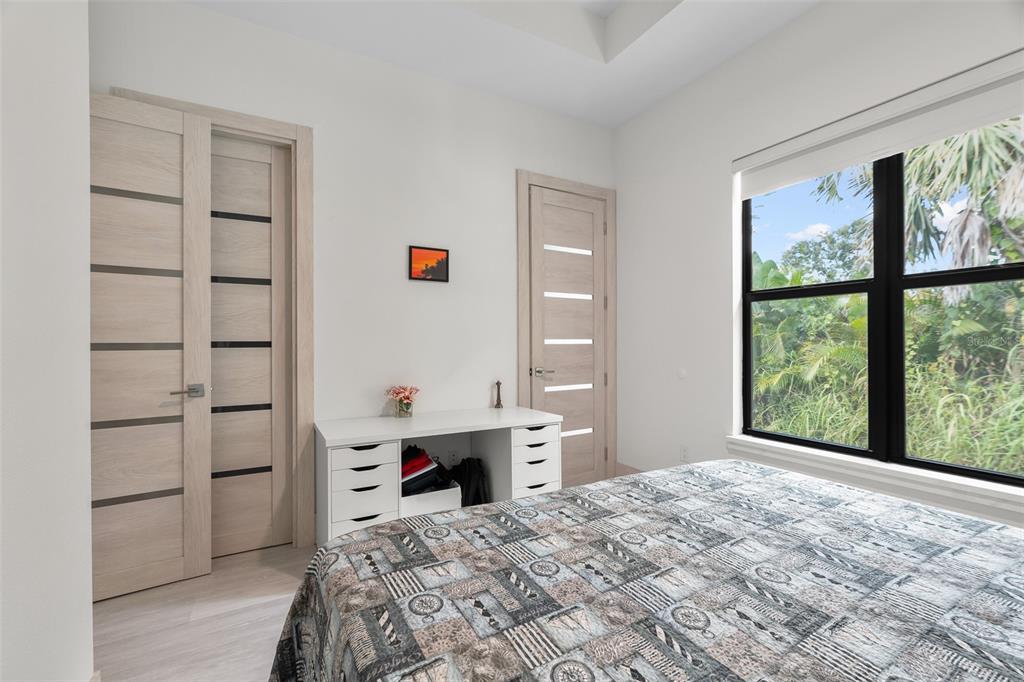 380 Cowry Road Venice, FL 34293 - Photo 32 of 44 a bedroom with a bed and a window