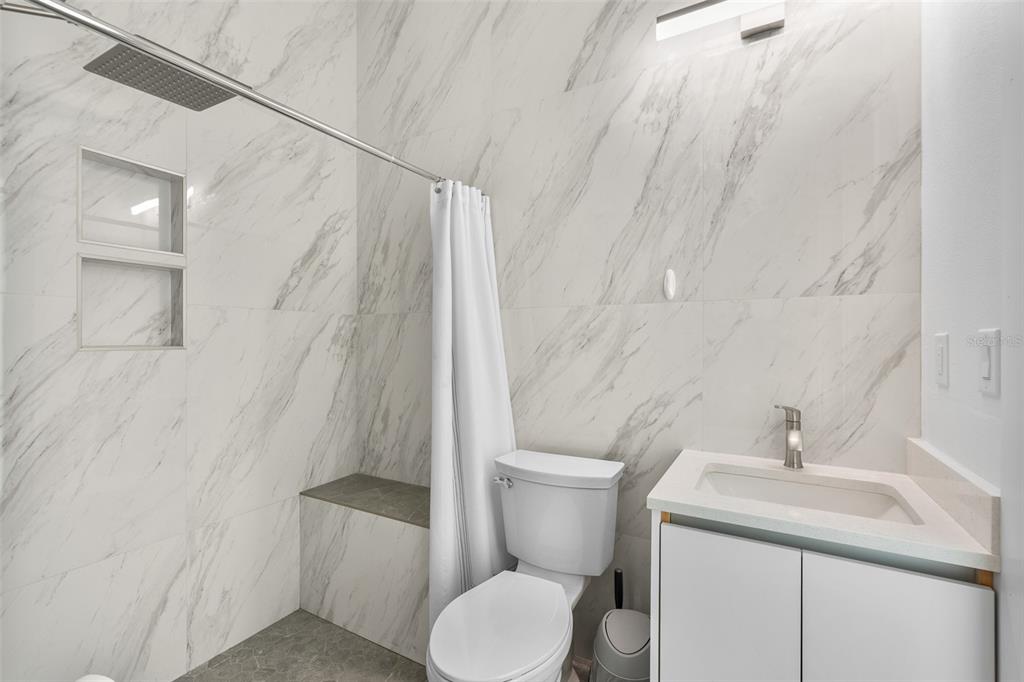 380 Cowry Road Venice, FL 34293 - Photo 33 of 44 a white toilet sitting next to a bathroom sink