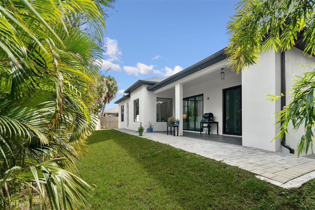 380 Cowry Road Venice, FL 34293 - Photo 40 of 44 a view of a chair and table in backyard of the house