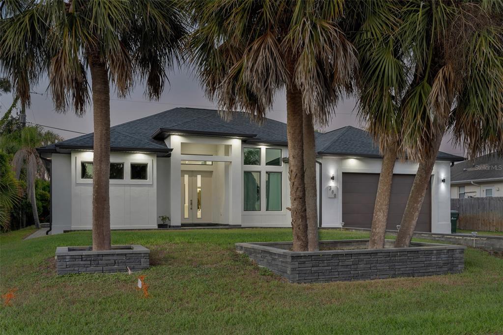 380 Cowry Road Venice, FL 34293 - Photo 43 of 44 a front view of house with yard and green space