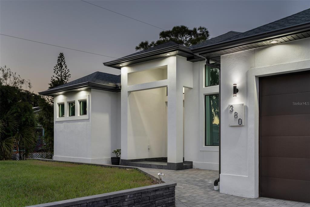 380 Cowry Road Venice, FL 34293 - Photo 5 of 44 a front view of a house with a yard