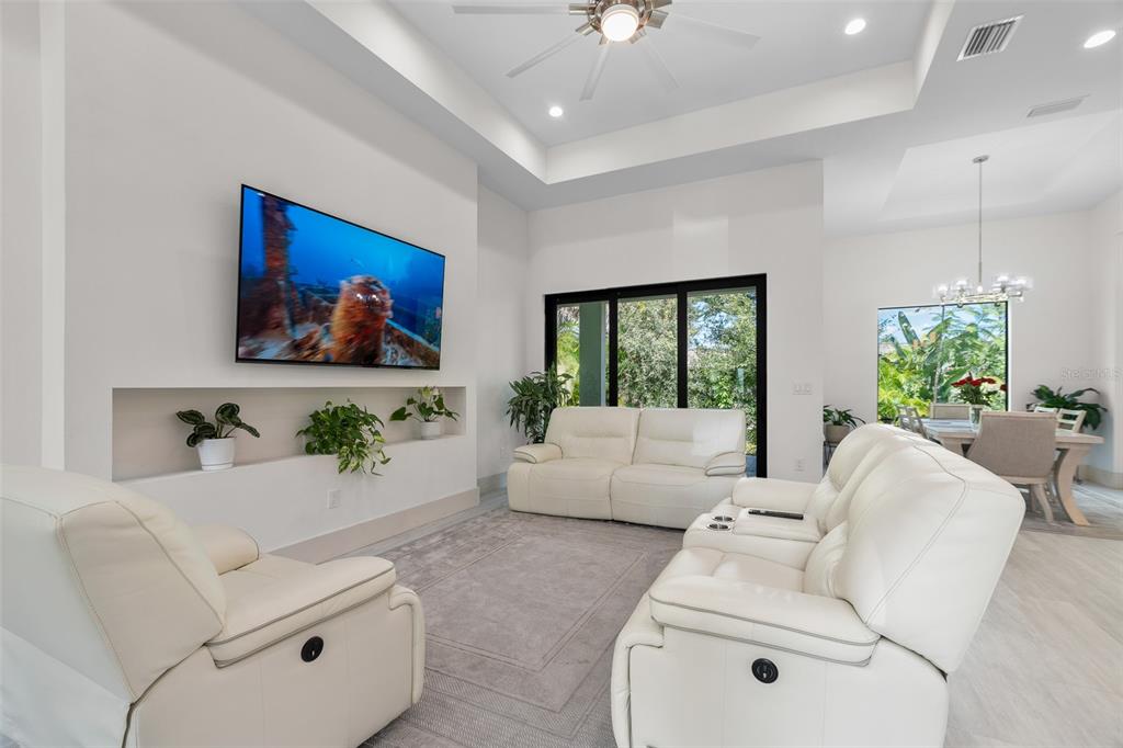 380 Cowry Road Venice, FL 34293 - Photo 8 of 44 a living room with furniture and a potted plant