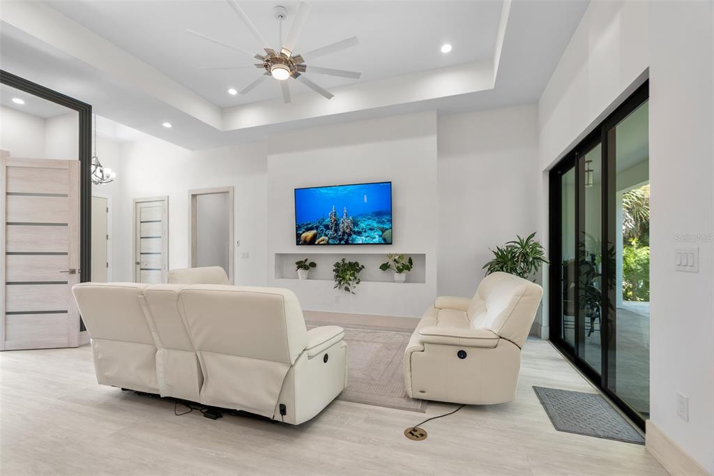 380 Cowry Road Venice, FL 34293 - Photo 9 of 44 a living room with furniture and a large window