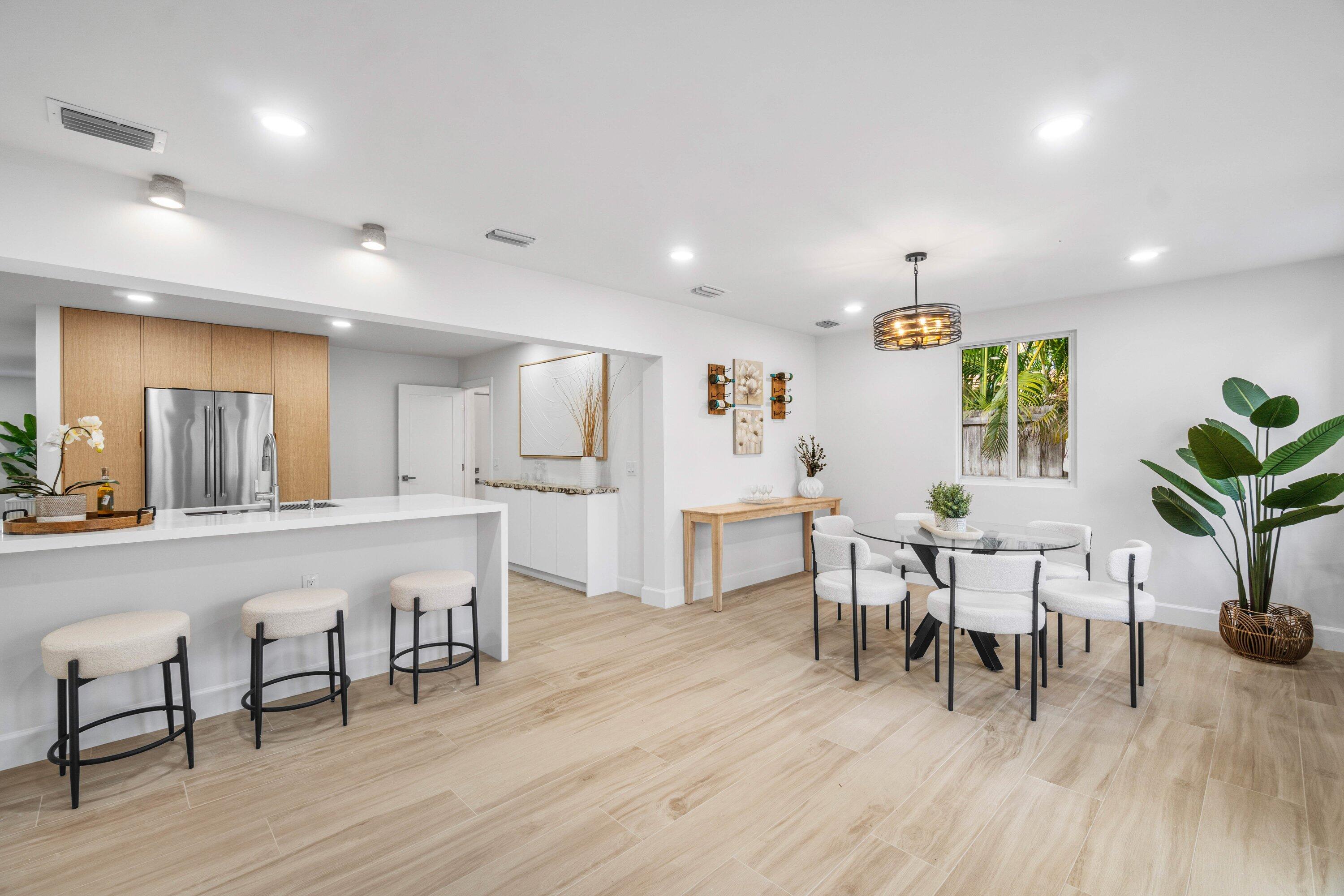 2634 Southwest 5th Street Boynton Beach, FL 33435 - Photo 1 of 57 a view of a dining room with furniture and wooden floor