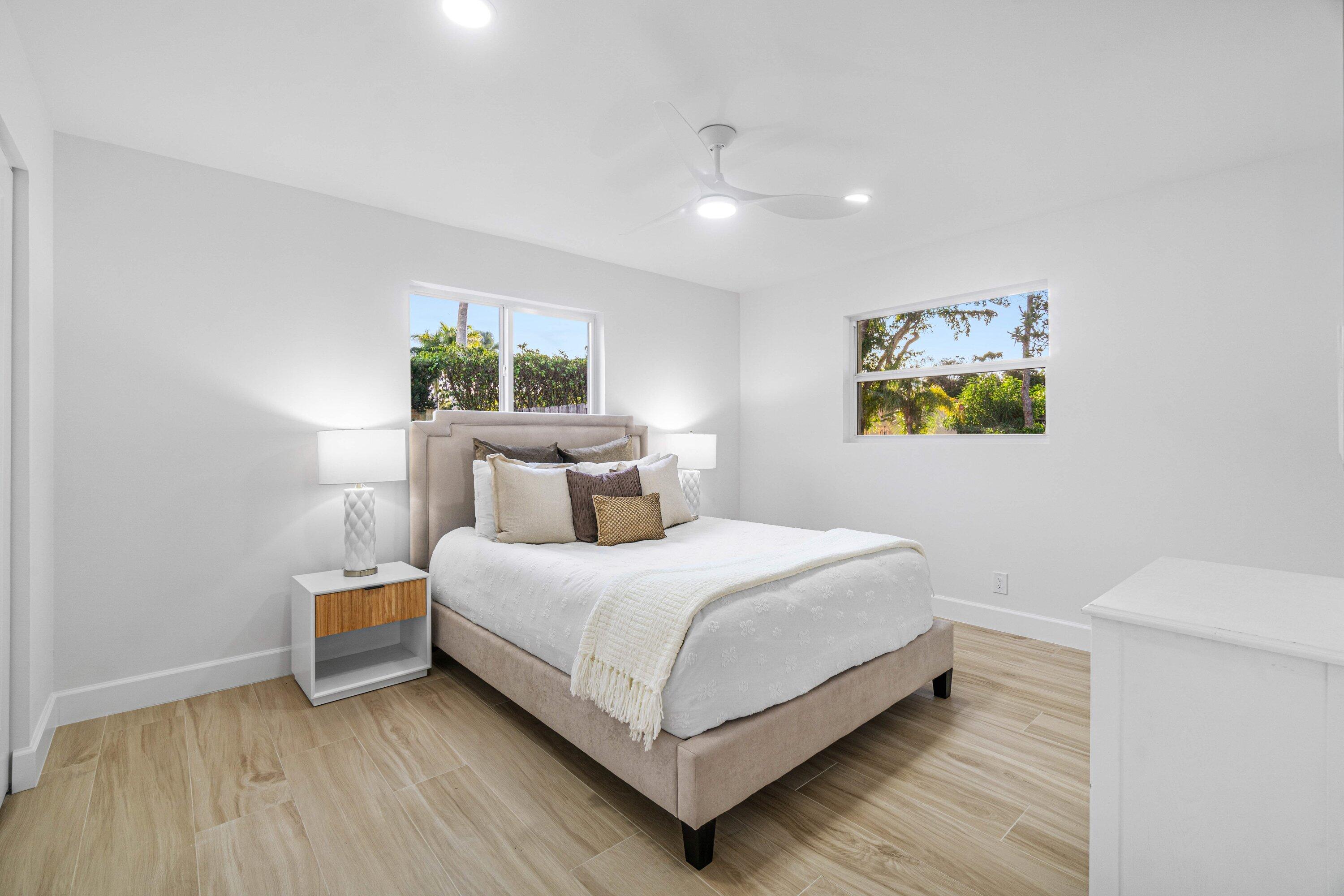 2634 Southwest 5th Street Boynton Beach, FL 33435 - Photo 24 of 57 a bedroom with a bed and a painting on the wall