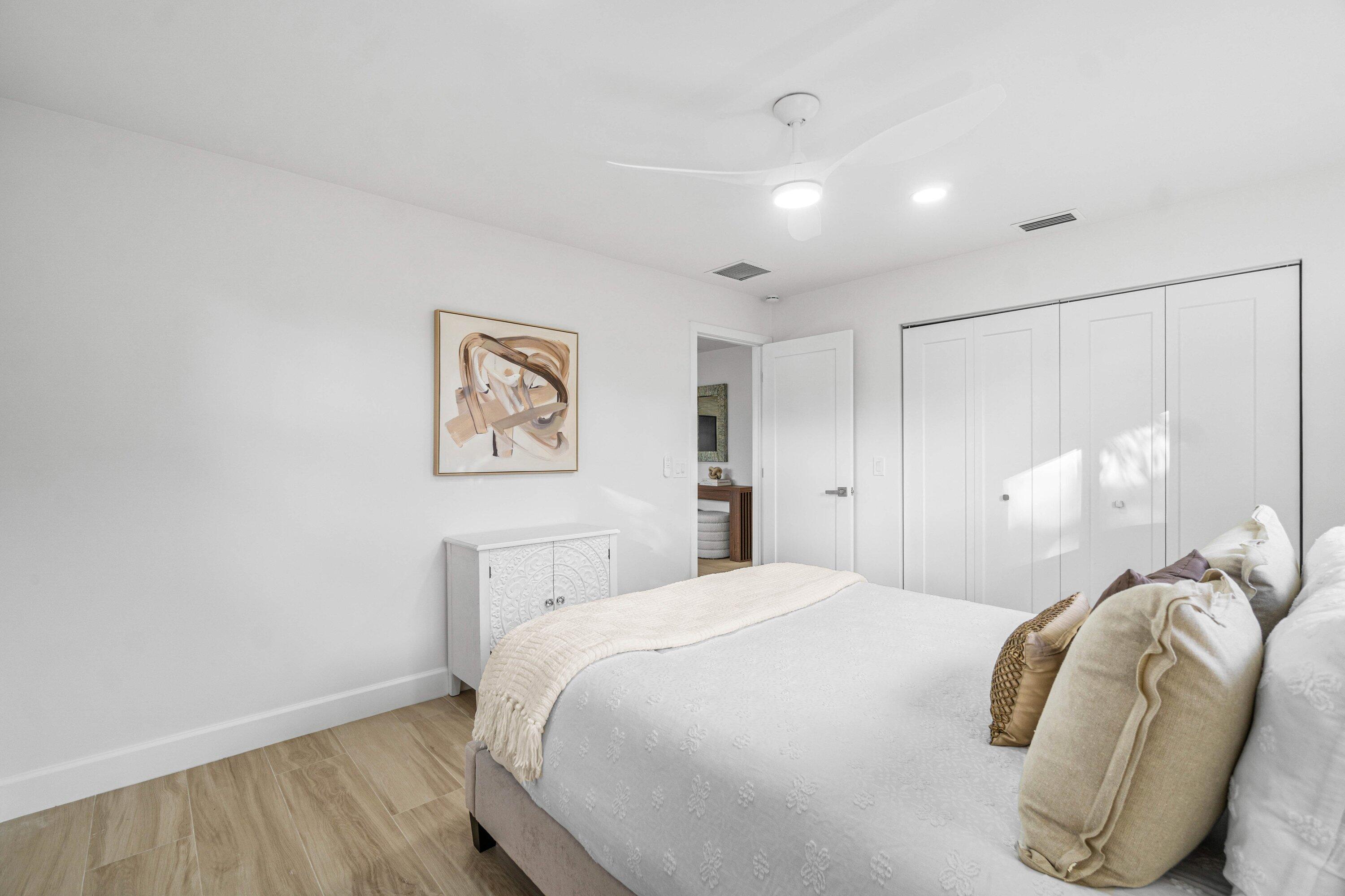 2634 Southwest 5th Street Boynton Beach, FL 33435 - Photo 25 of 57 a bedroom with a bed and a painting on the wall