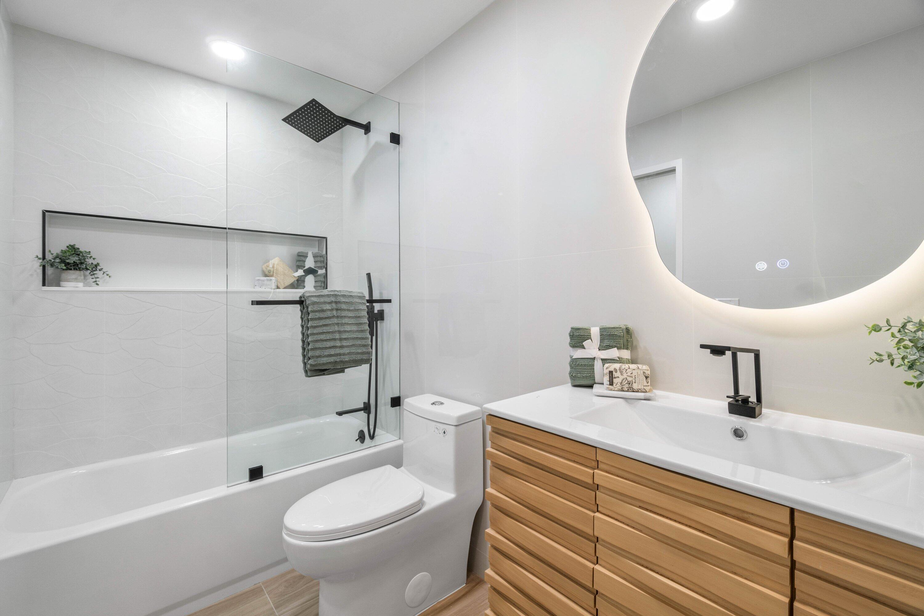 2634 Southwest 5th Street Boynton Beach, FL 33435 - Photo 26 of 57 a bathroom with a sink a toilet and shower