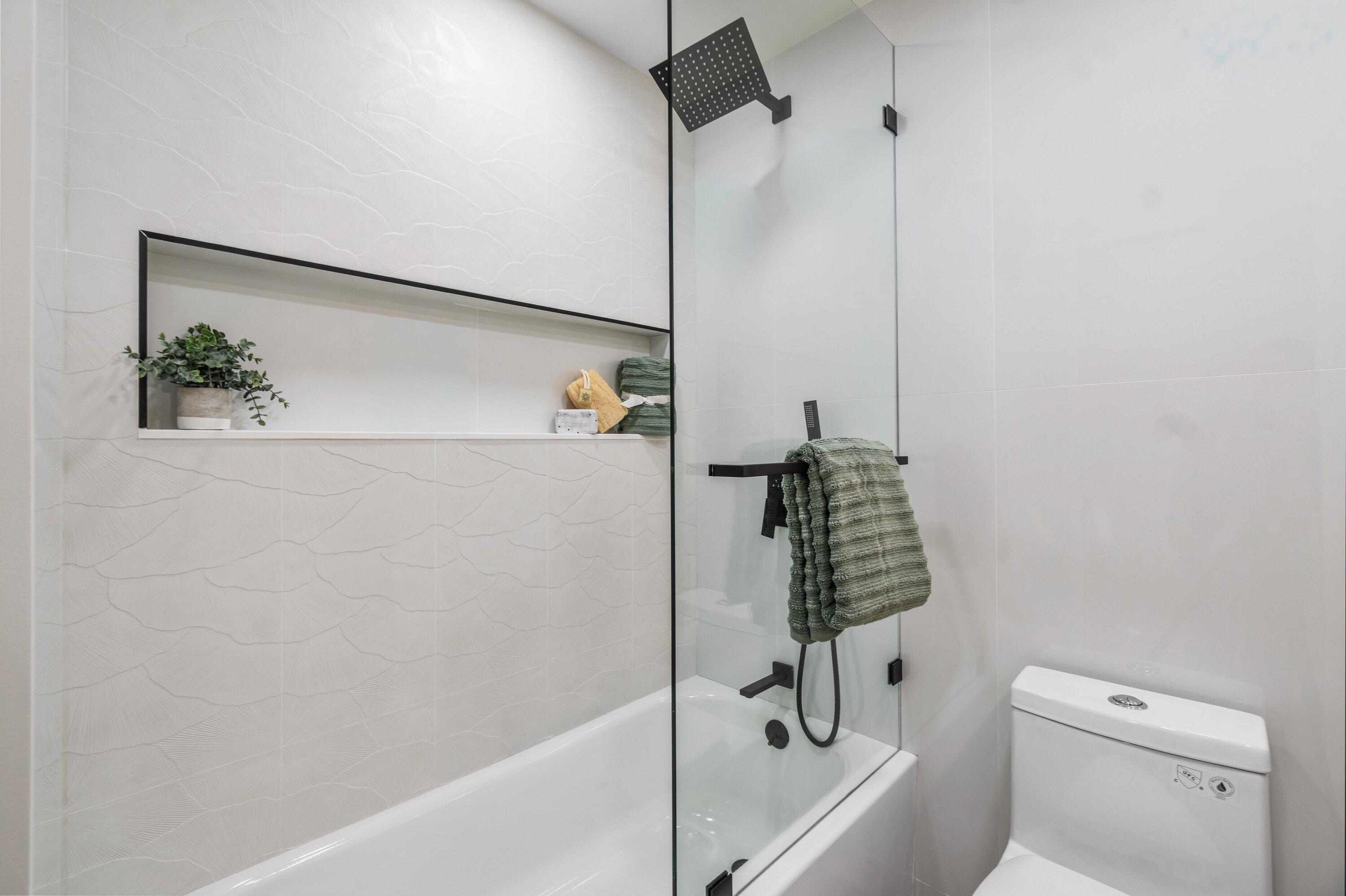 2634 Southwest 5th Street Boynton Beach, FL 33435 - Photo 28 of 57 a bathroom with a shower and a toilet