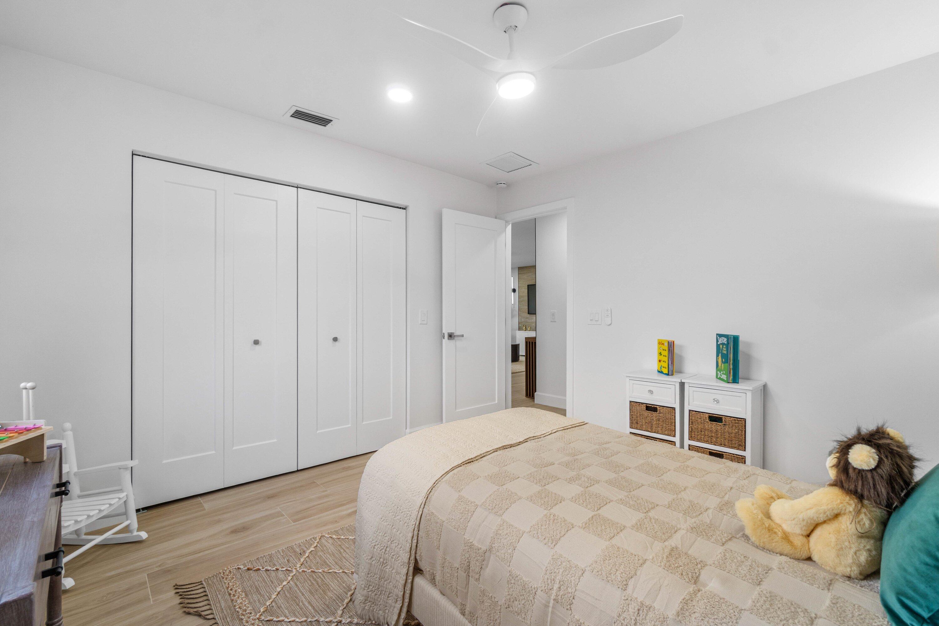 2634 Southwest 5th Street Boynton Beach, FL 33435 - Photo 30 of 57 a bedroom with a bed and a window