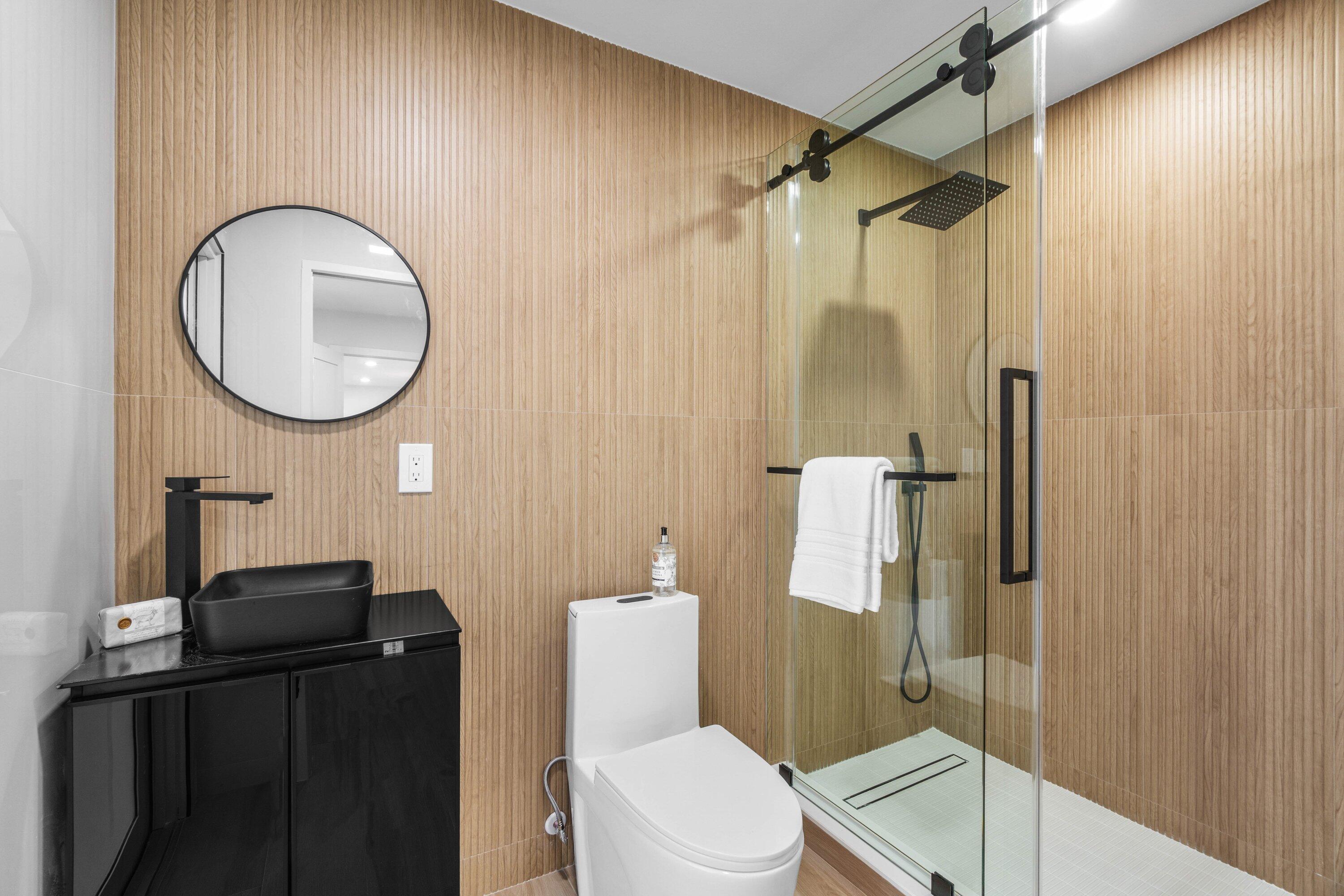 2634 Southwest 5th Street Boynton Beach, FL 33435 - Photo 31 of 57 a bathroom with a toilet a sink and shower