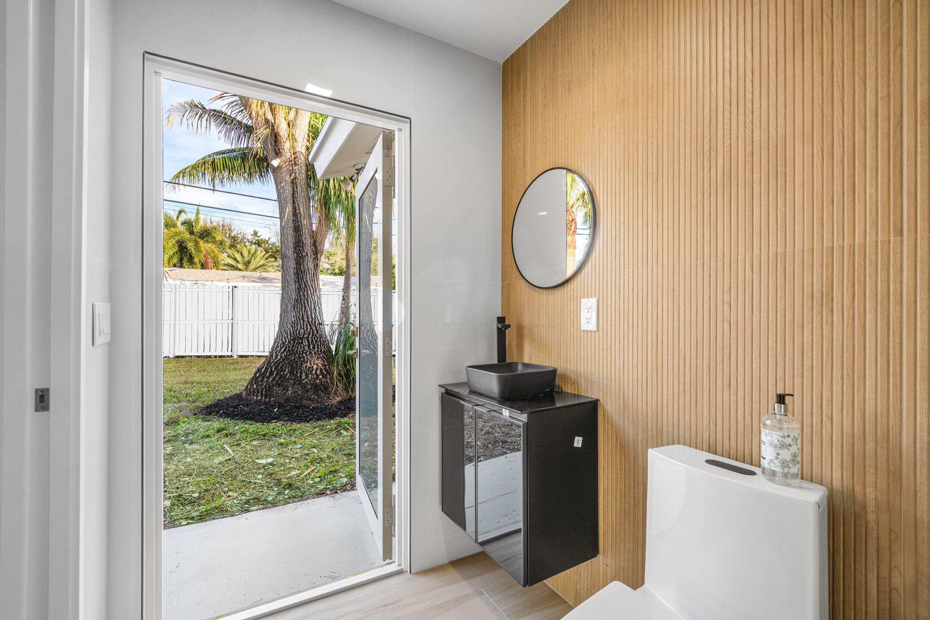 2634 Southwest 5th Street Boynton Beach, FL 33435 - Photo 33 of 57 a bathroom with a toilet and a sink