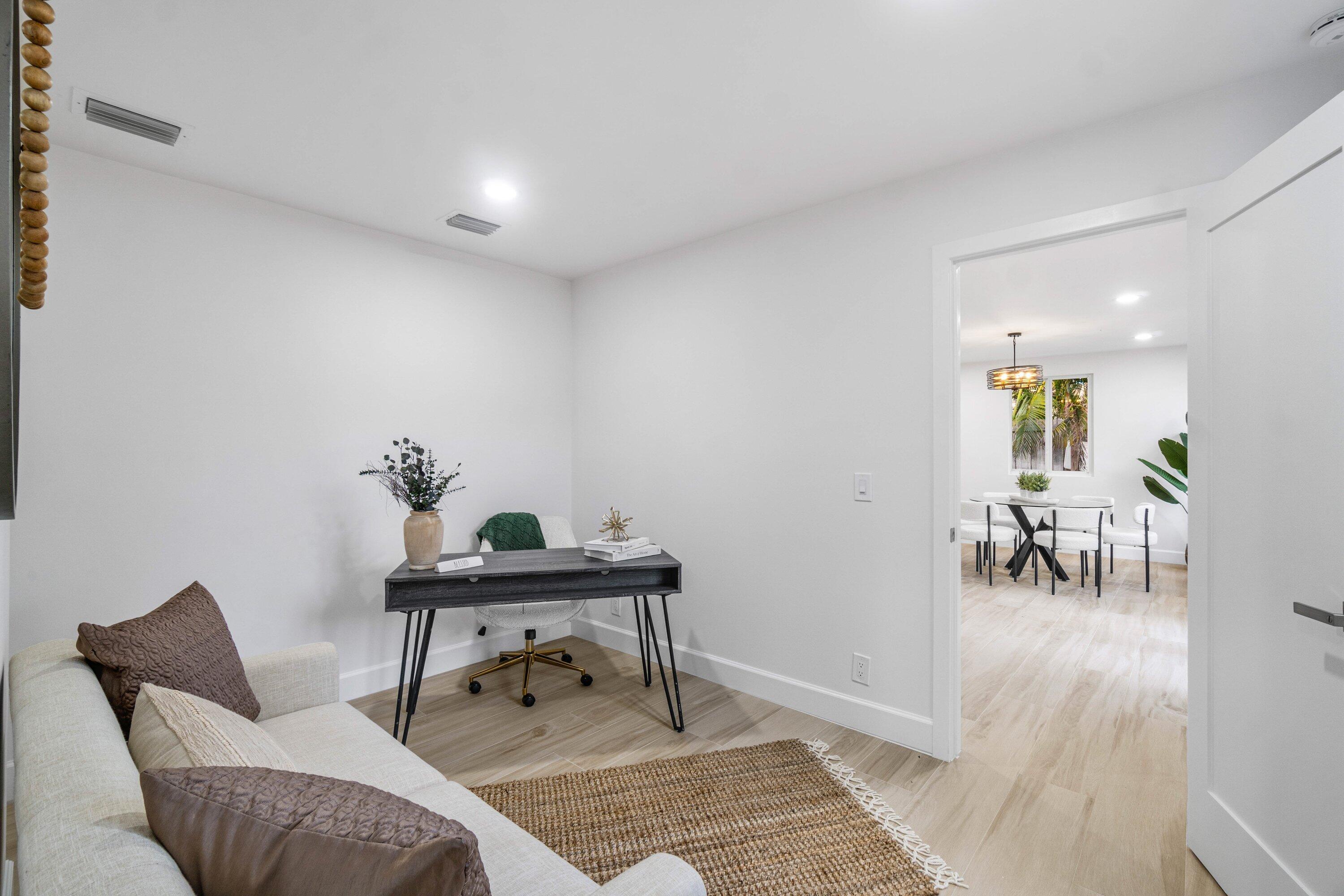 2634 Southwest 5th Street Boynton Beach, FL 33435 - Photo 35 of 57 a living room with furniture and a dining table with wooden floor
