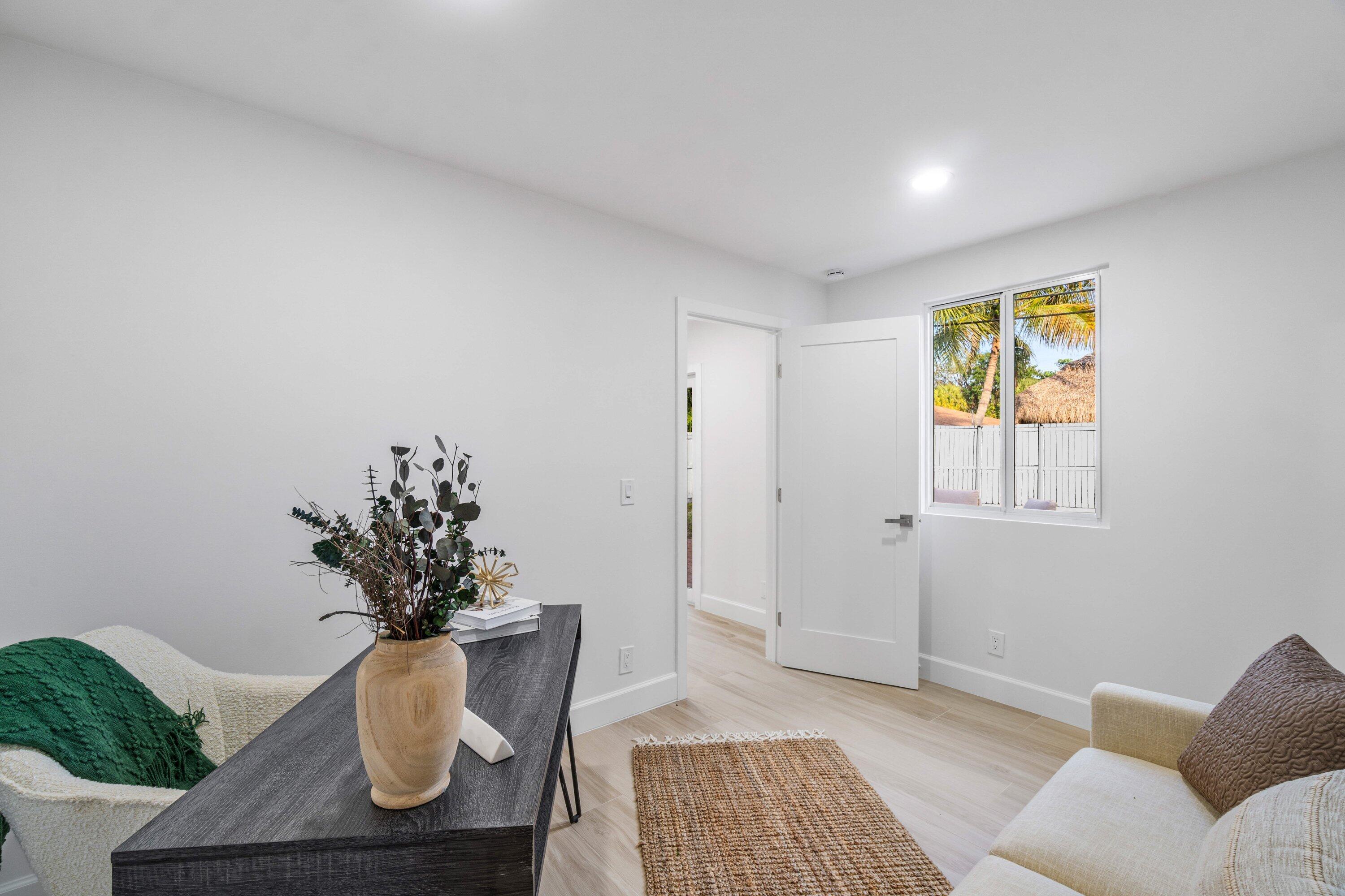 2634 Southwest 5th Street Boynton Beach, FL 33435 - Photo 36 of 57 a living room with furniture and a potted plant