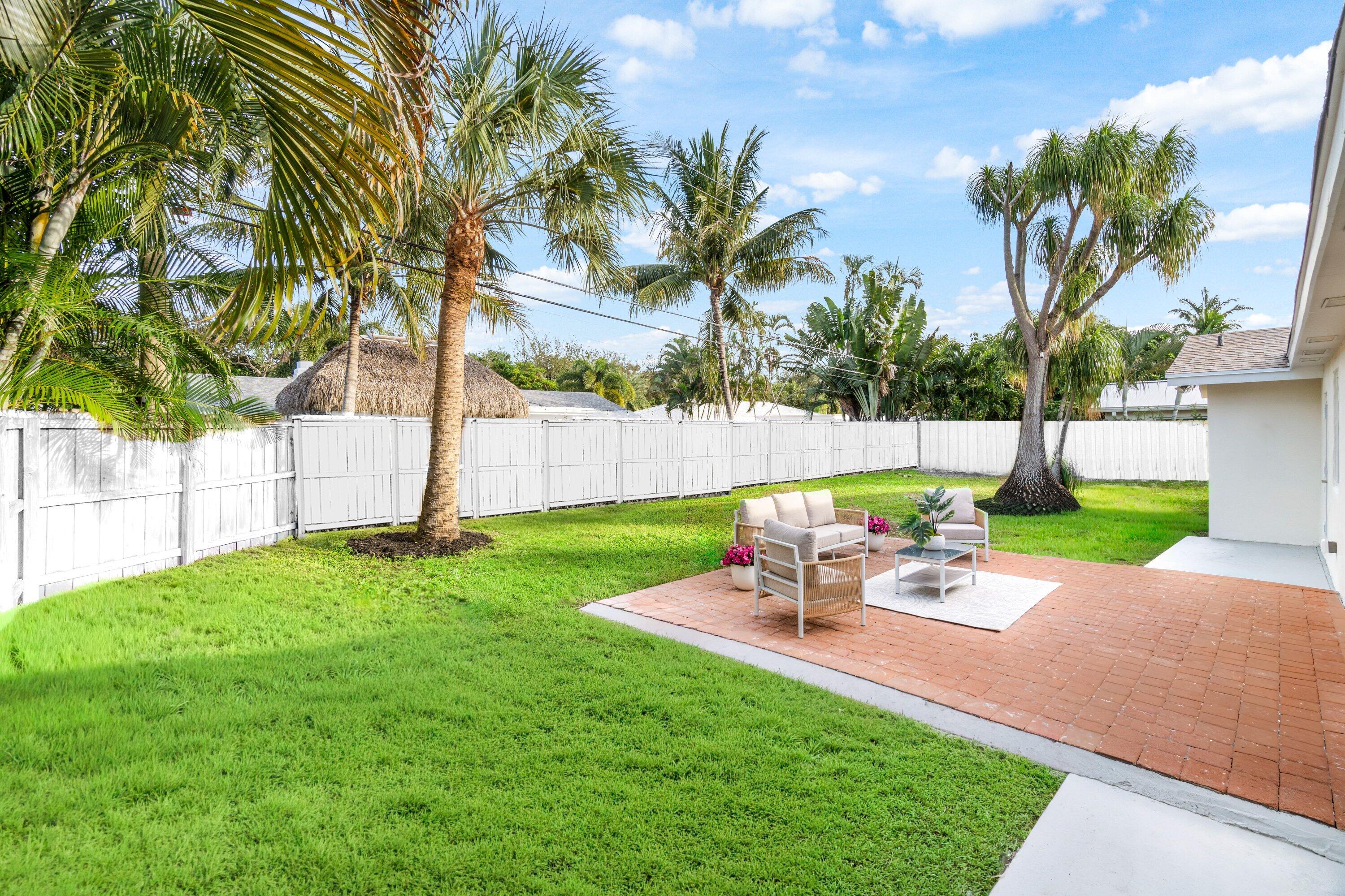 2634 Southwest 5th Street Boynton Beach, FL 33435 - Photo 39 of 57 a view of a chair and table in the garden