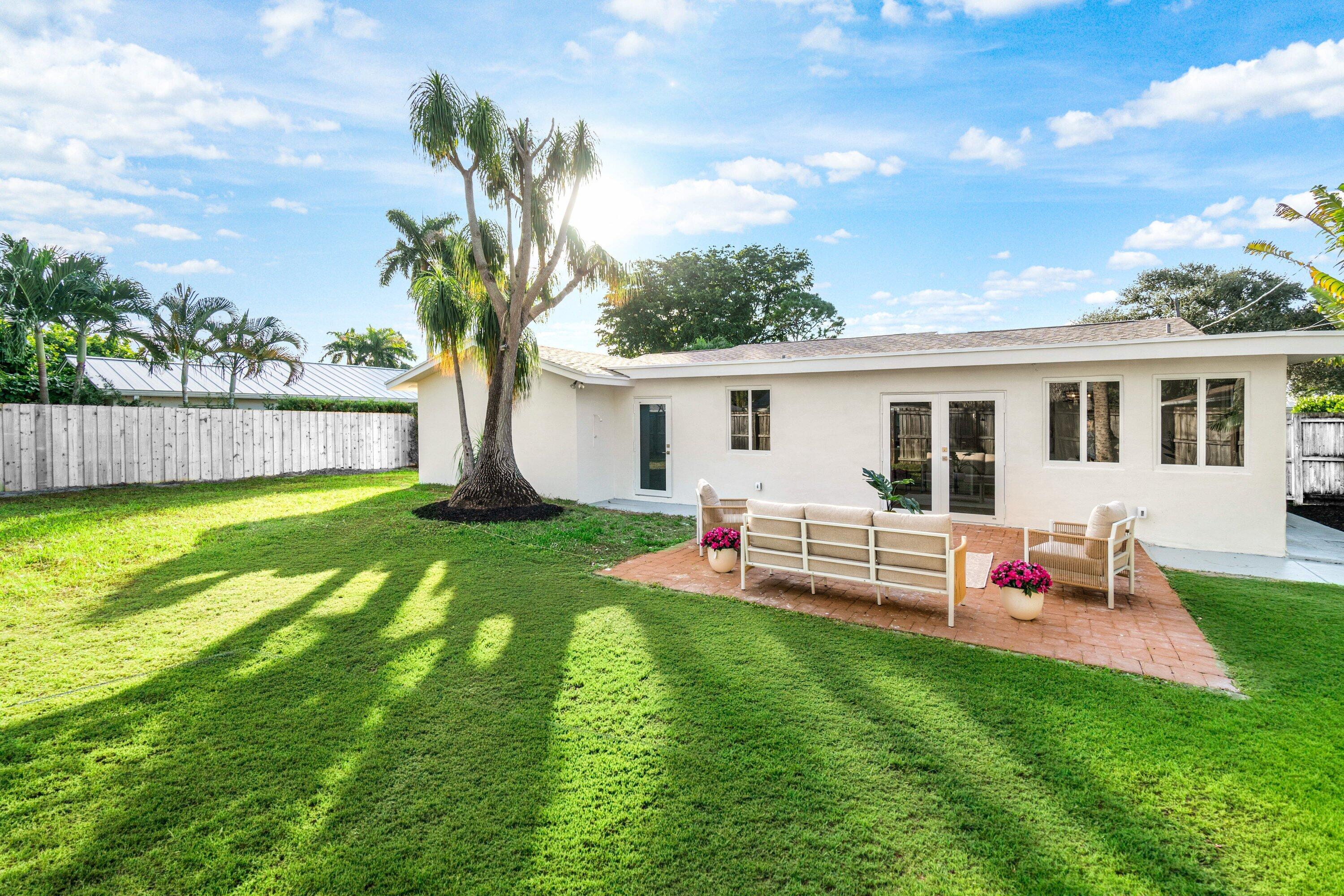 2634 Southwest 5th Street Boynton Beach, FL 33435 - Photo 40 of 57 a front view of house with yard and seating area