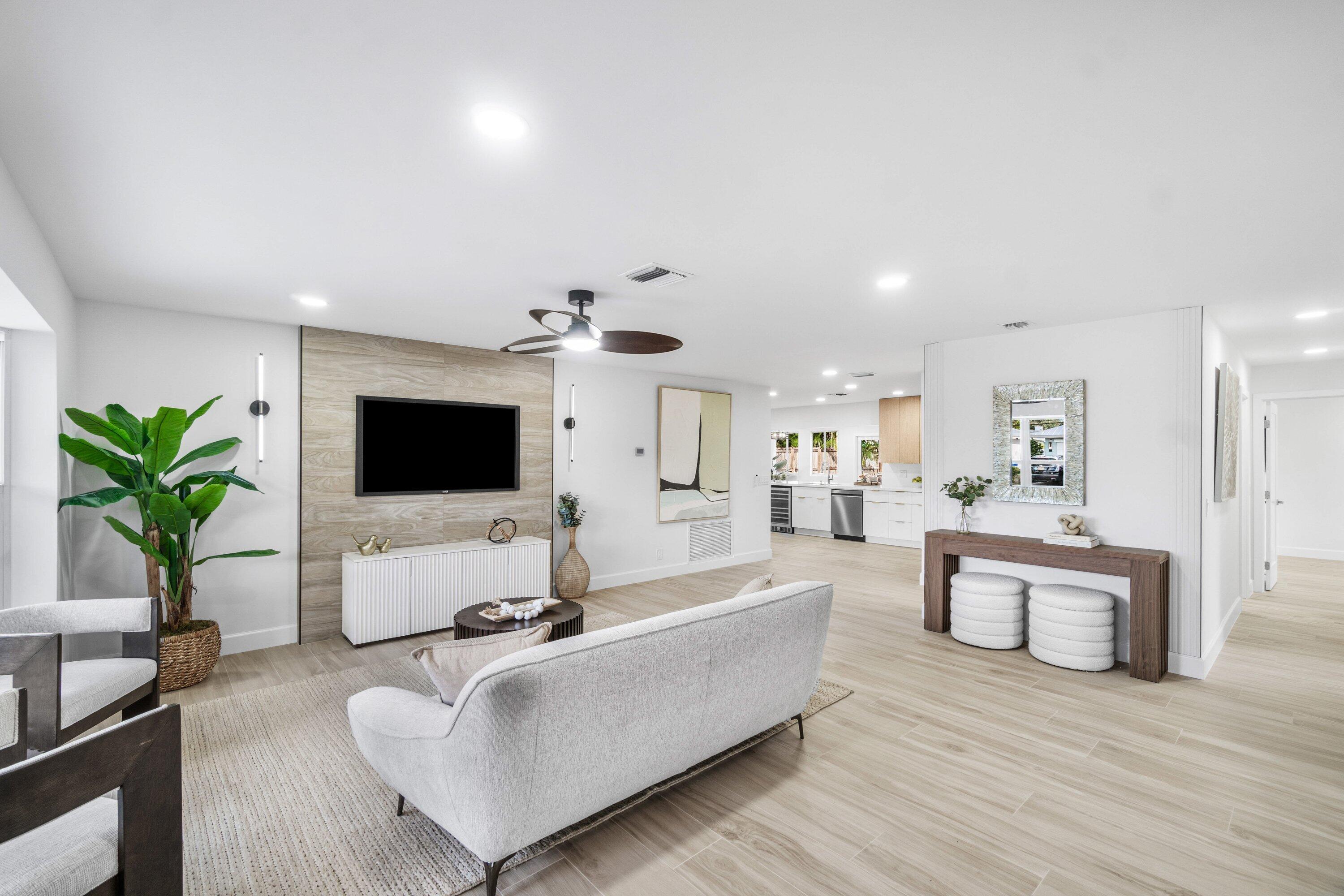 2634 Southwest 5th Street Boynton Beach, FL 33435 - Photo 4 of 57 a living room with furniture and a flat screen tv