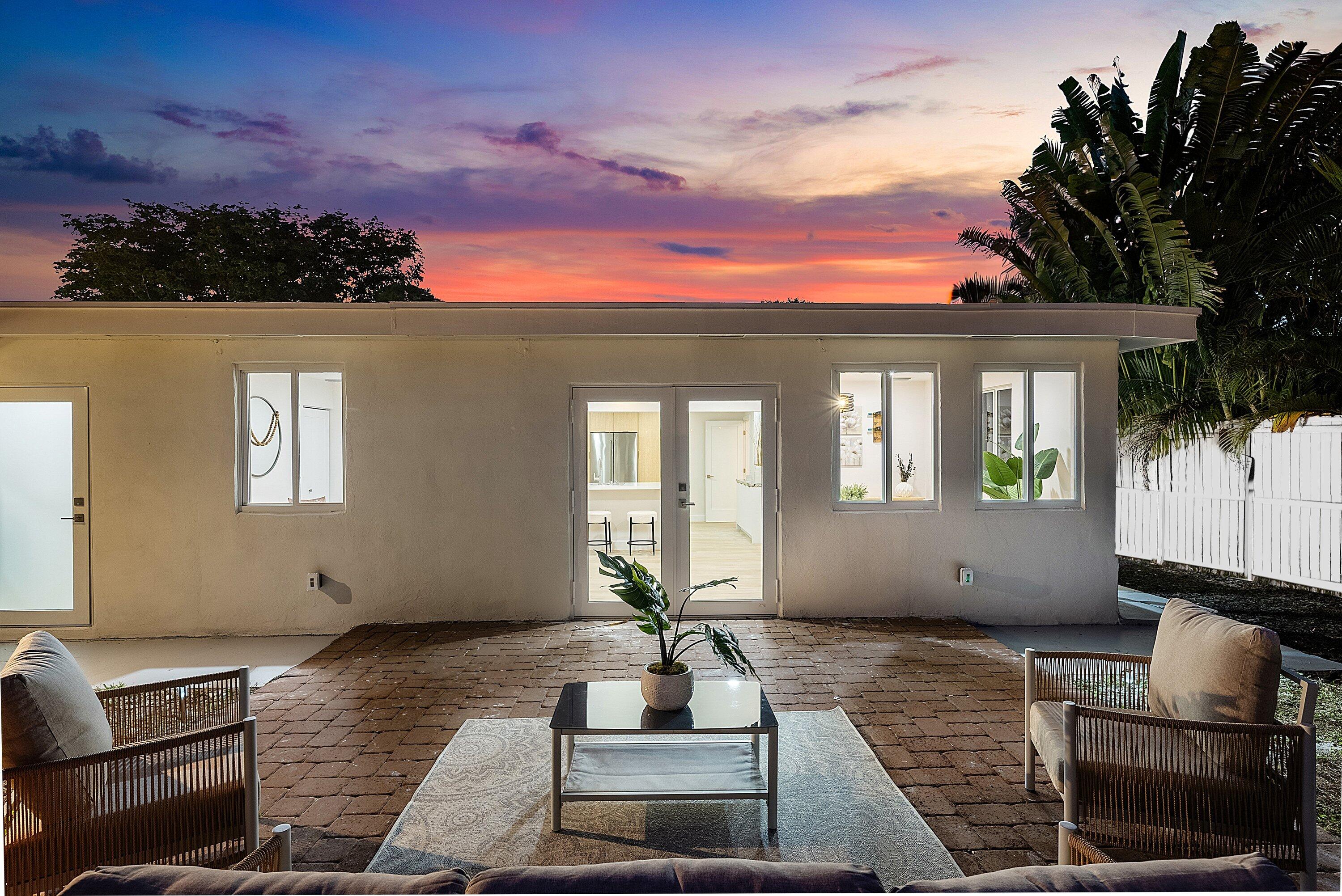 2634 Southwest 5th Street Boynton Beach, FL 33435 - Photo 45 of 57 a front view of a house with a garden