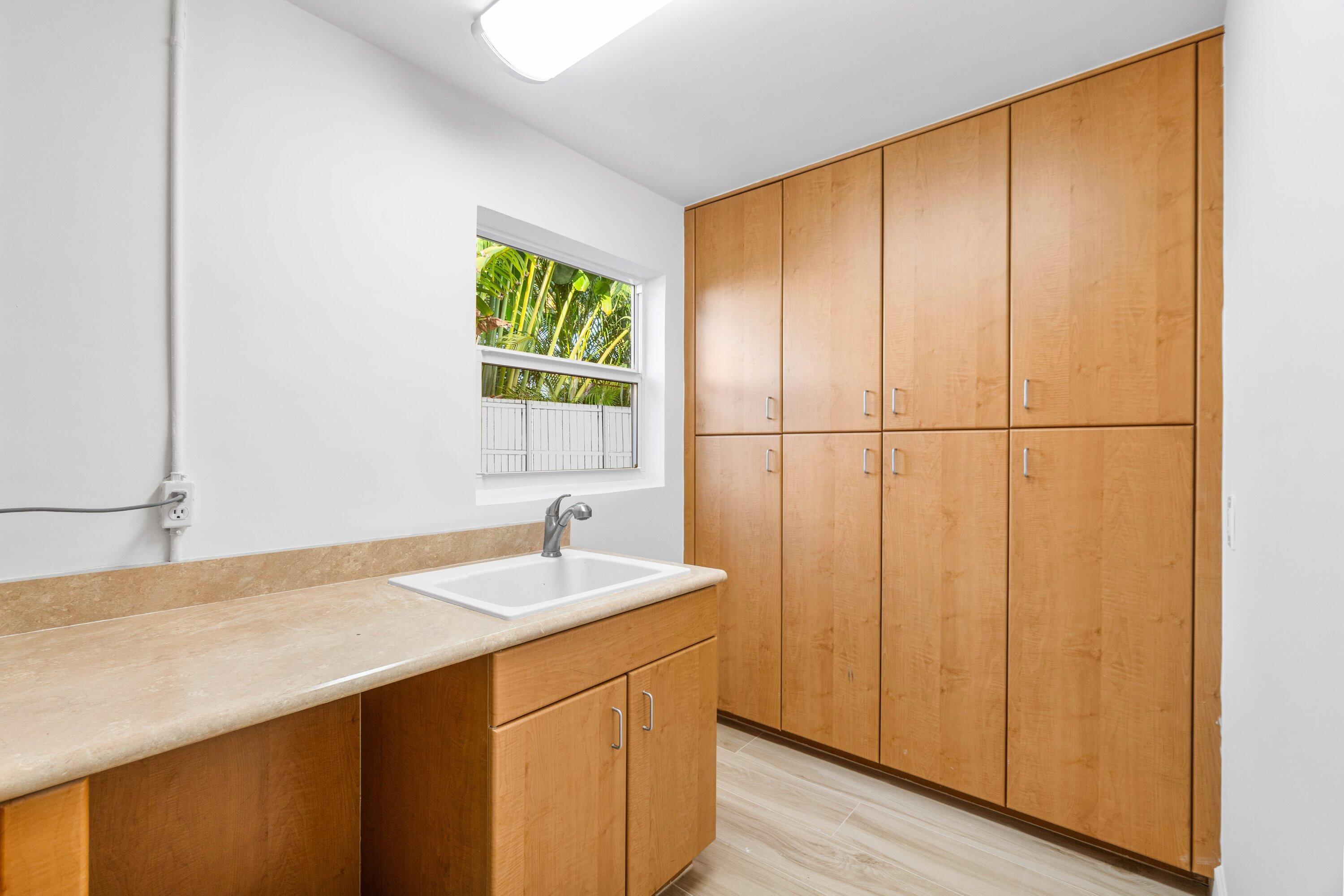 2634 Southwest 5th Street Boynton Beach, FL 33435 - Photo 49 of 57 a bathroom with a sink and a mirror