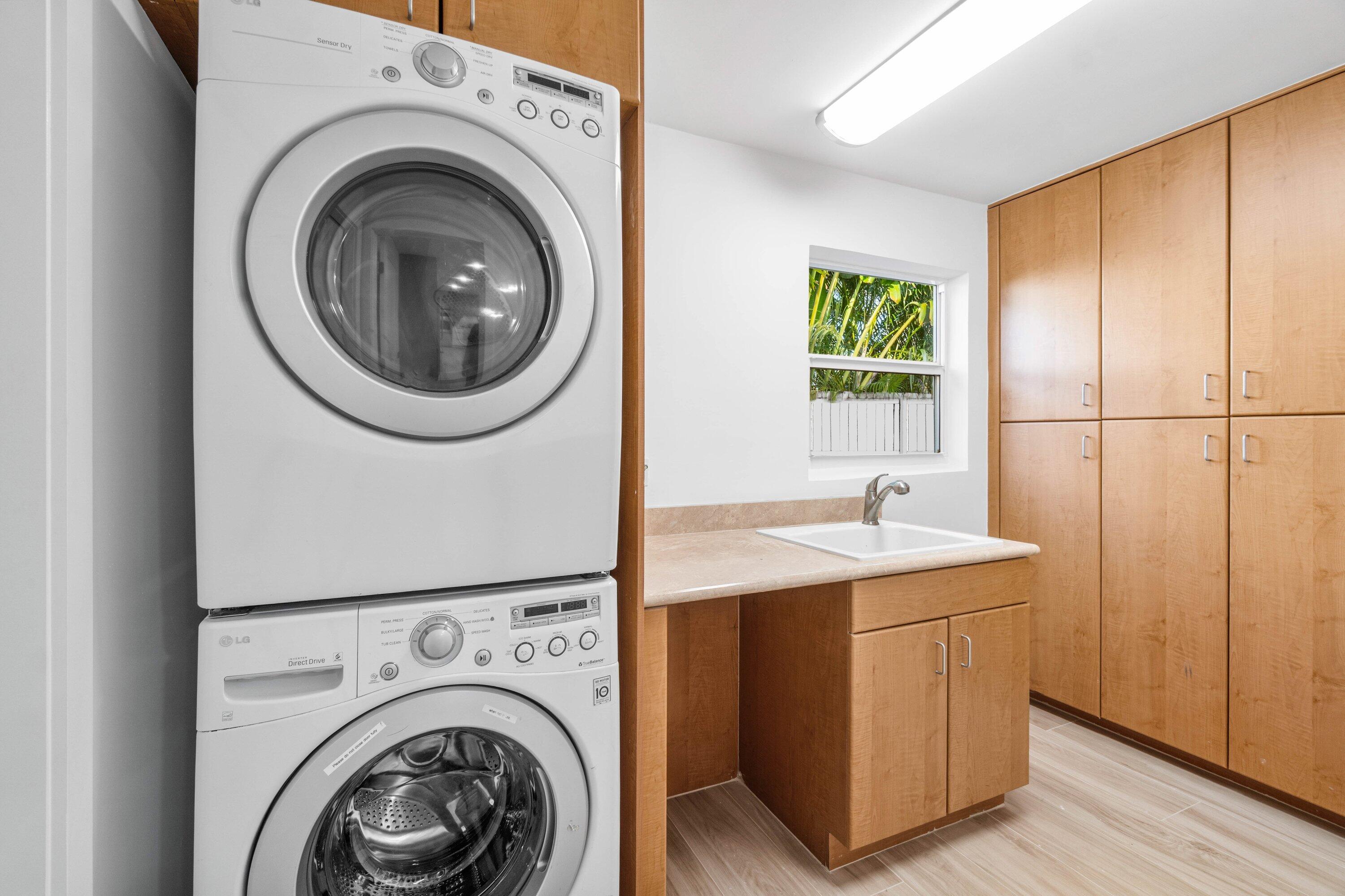 2634 Southwest 5th Street Boynton Beach, FL 33435 - Photo 50 of 57 a view of a storage & utility room with washer and dryer