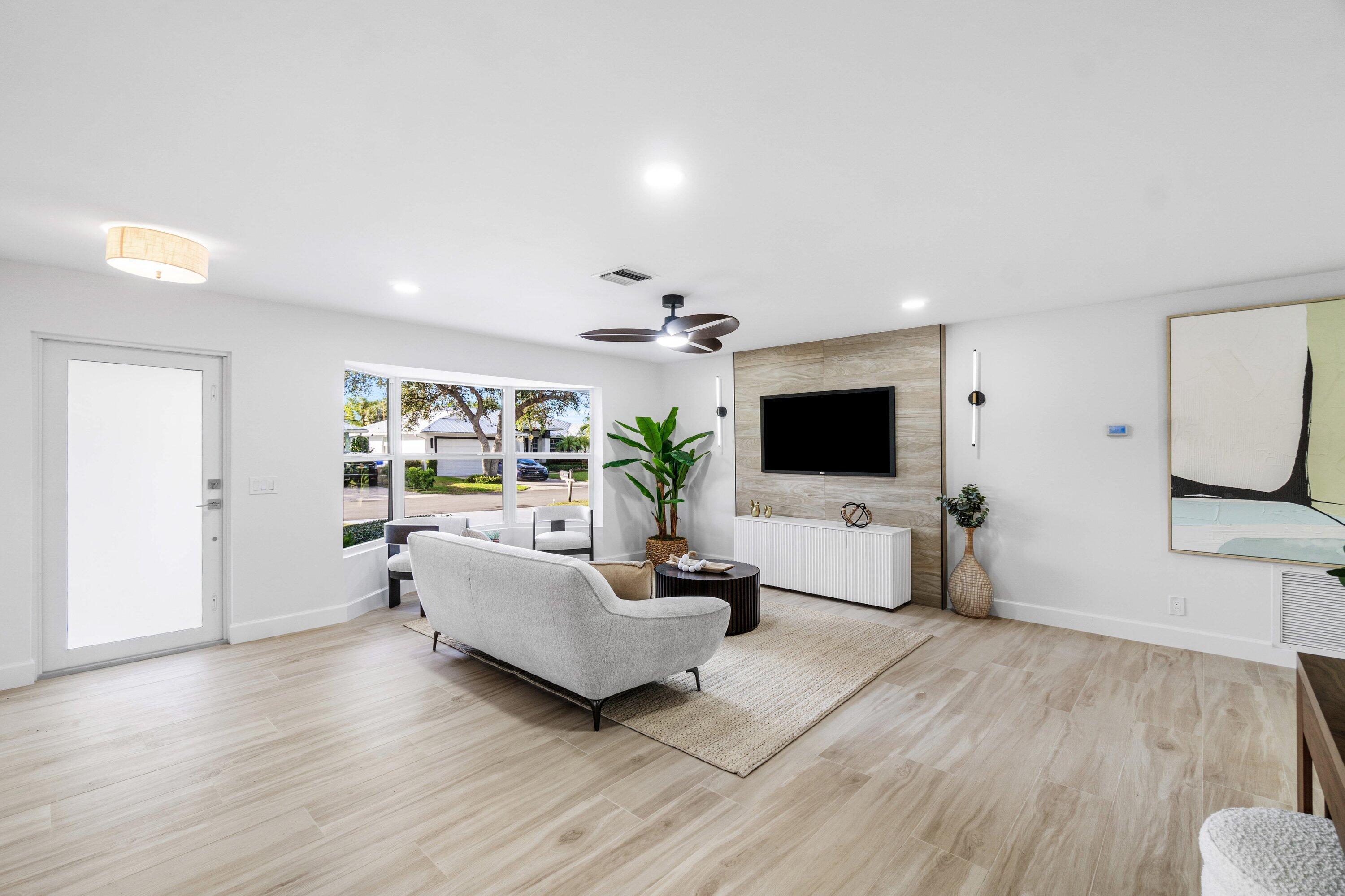2634 Southwest 5th Street Boynton Beach, FL 33435 - Photo 5 of 57 a living room with furniture and a flat screen tv