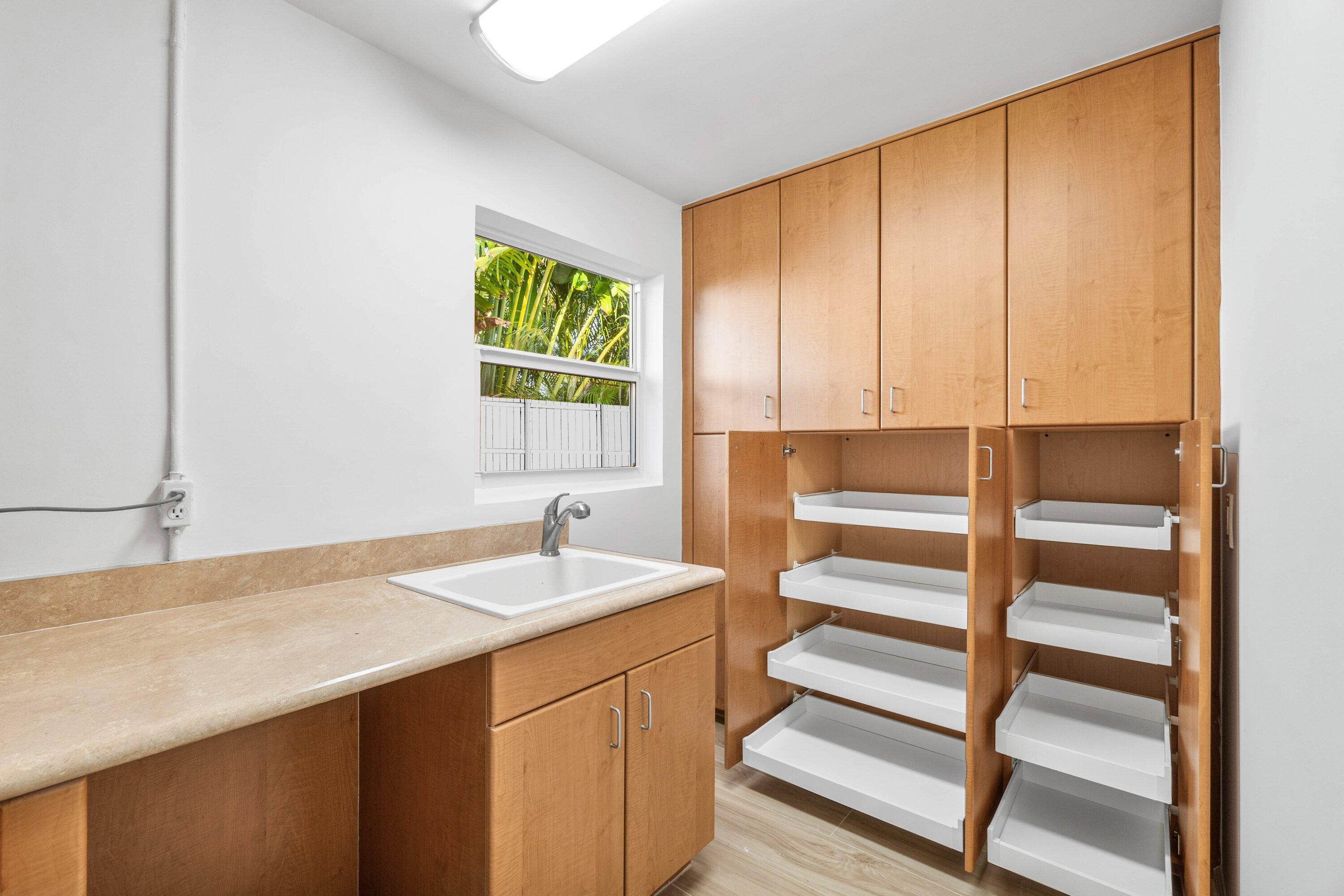 2634 Southwest 5th Street Boynton Beach, FL 33435 - Photo 51 of 57 a bathroom with a sink and a mirror