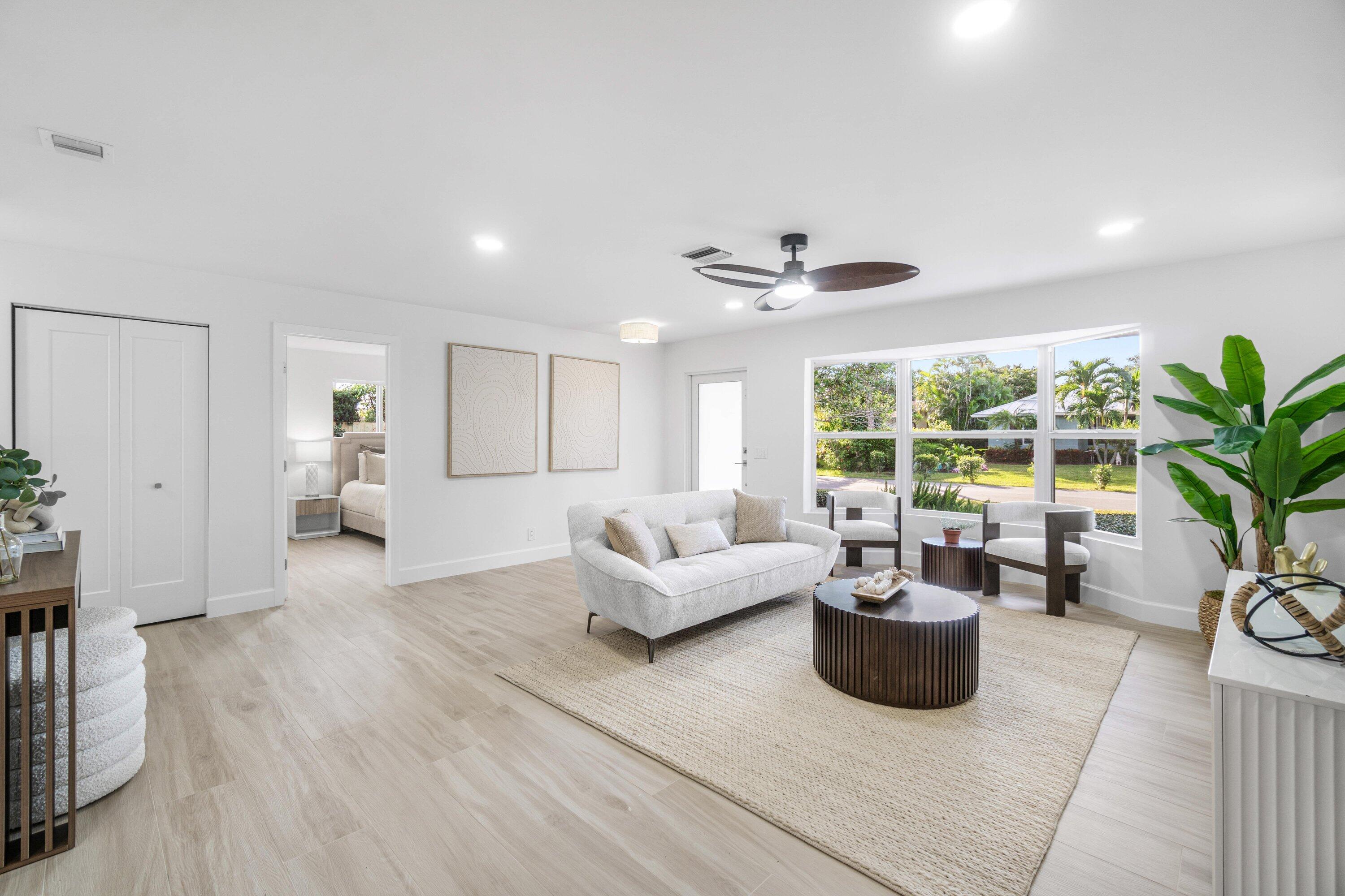 2634 Southwest 5th Street Boynton Beach, FL 33435 - Photo 6 of 57 a living room with furniture and a potted plant