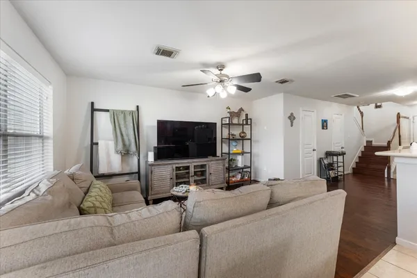 a bathroom with a tub sink vanity and mirror