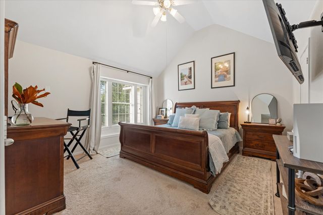 a bed room with a bed and a chandelier