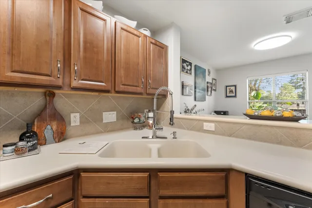 a kitchen with a sink and cabinets
