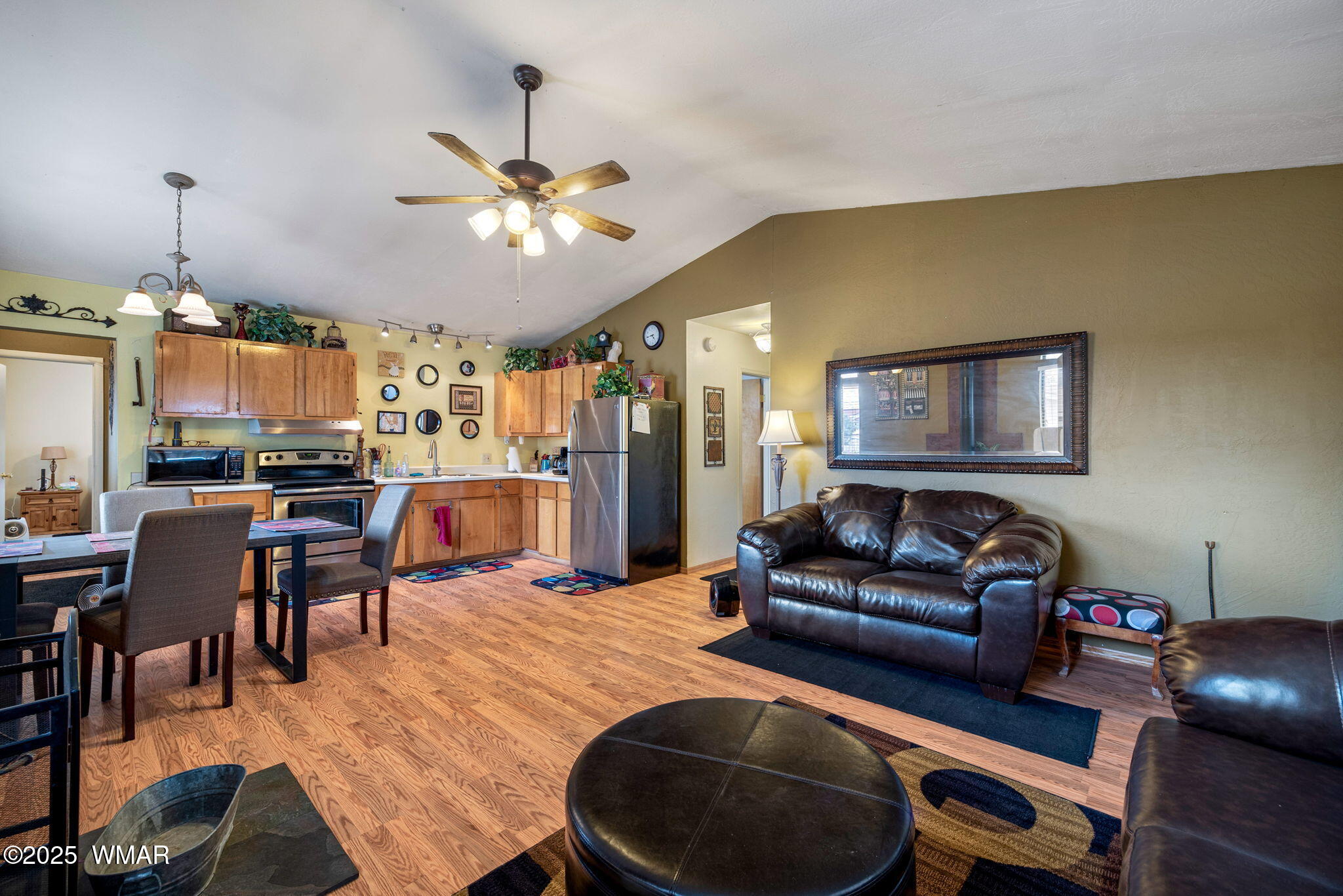 2051 Lumber Valley Road Overgaard, AZ 85933 - Photo 12 of 30 a living room with furniture and a chandelier