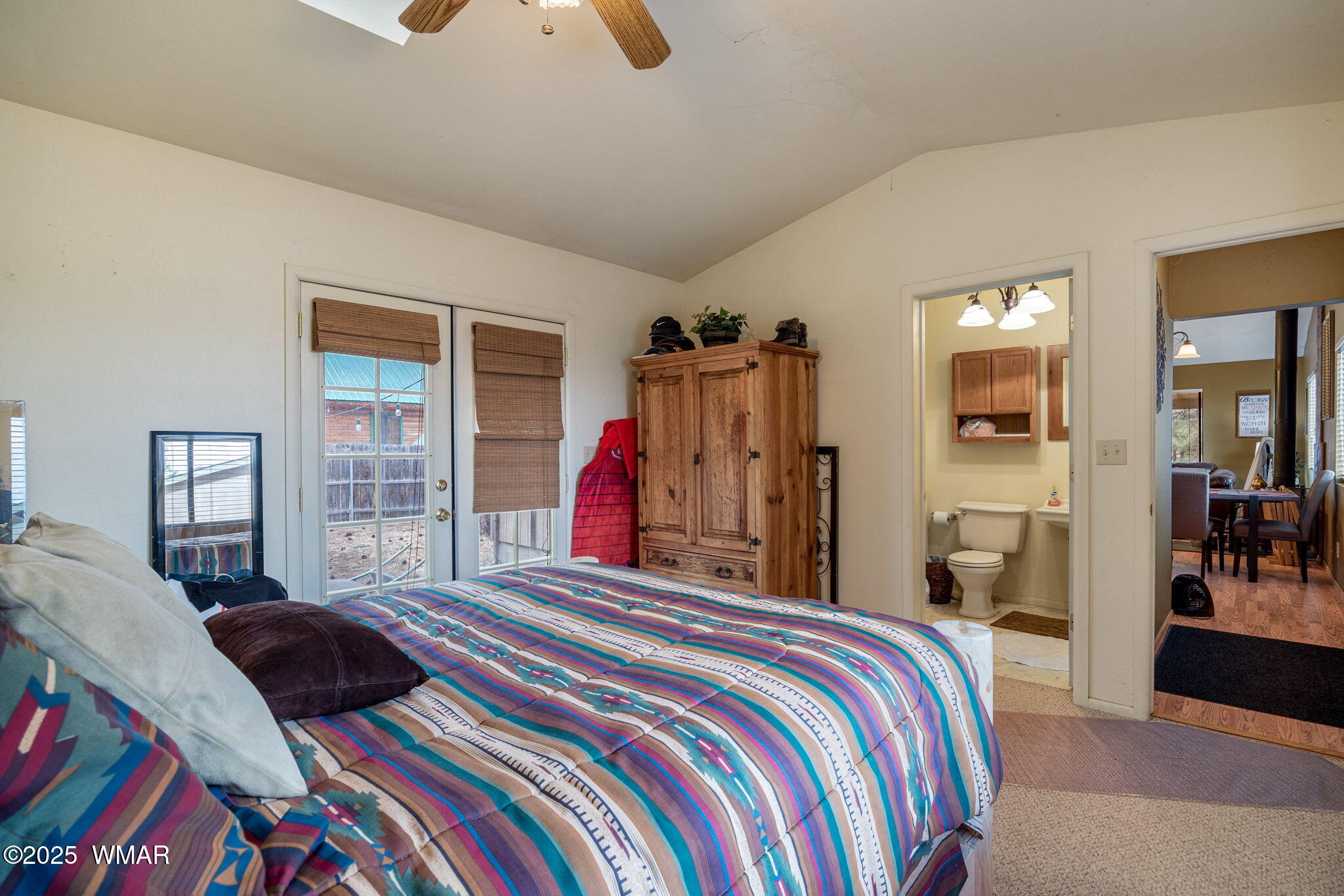 2051 Lumber Valley Road Overgaard, AZ 85933 - Photo 14 of 30 a bedroom with a bed and a large mirror on a dresser