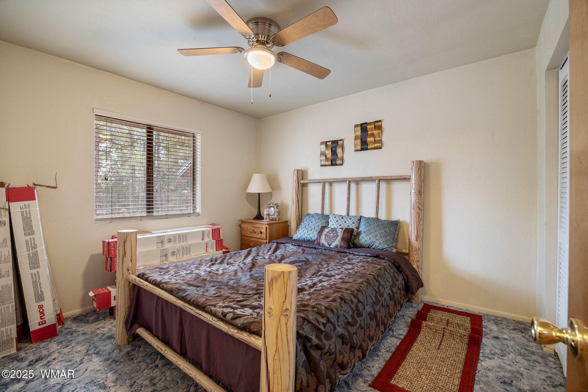 2051 Lumber Valley Road Overgaard, AZ 85933 - Photo 16 of 30 a bed sitting in a bedroom next to a window